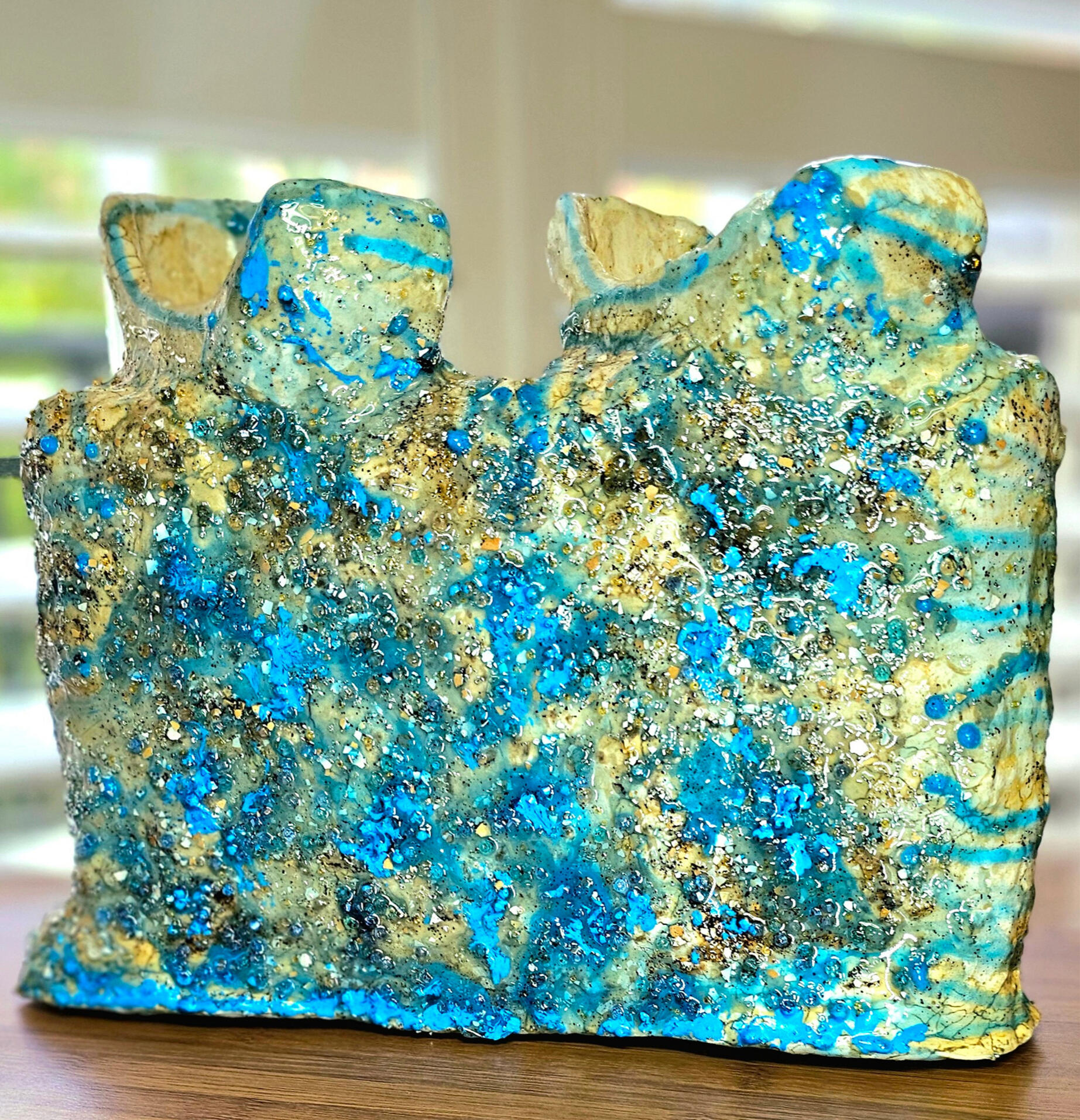Formed from a recycled plastic egg rack, The Jewel of The Sea becomes a sculptural reflection on resilience, memory, and transformation.