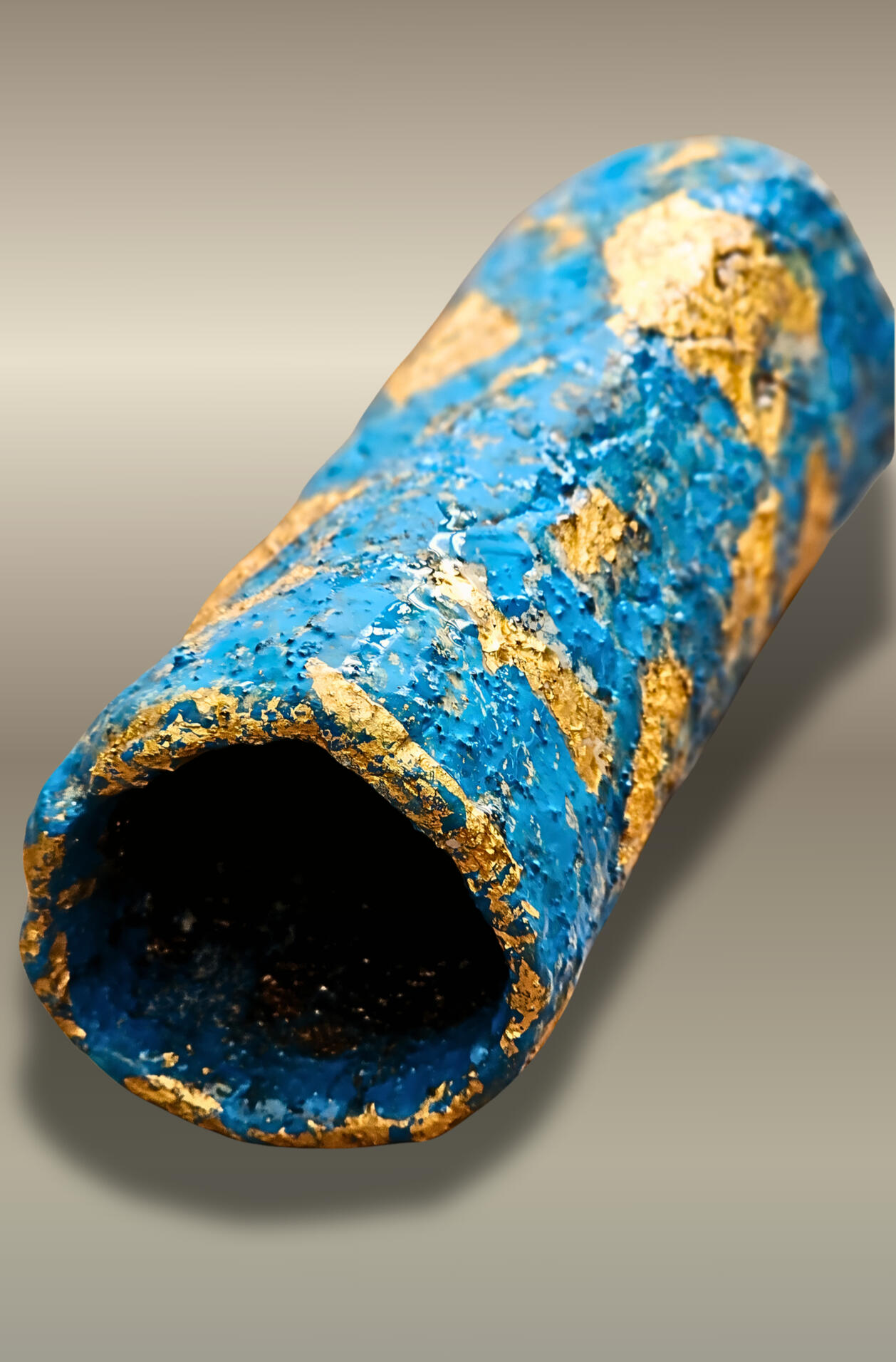 Built on a cloth base and reinforced with plaster gauze, the sculpture is hand-shaped in _air-dry clay_ , finished with acrylic and subtle accents of _24k gold_ that are delicately applied to introducing a quiet alchemical presence within the sculpture.